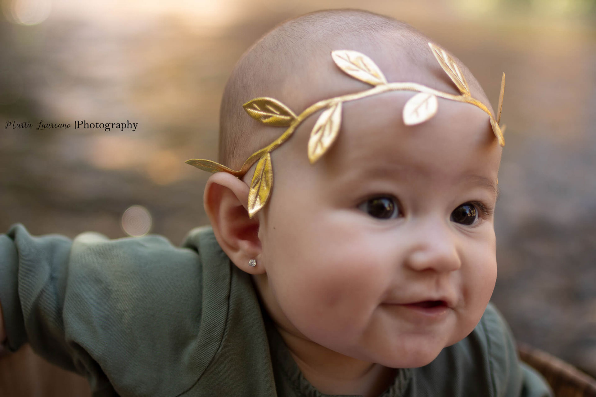 Baby with gold leaf headband