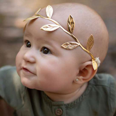 baby with gold leaf crown